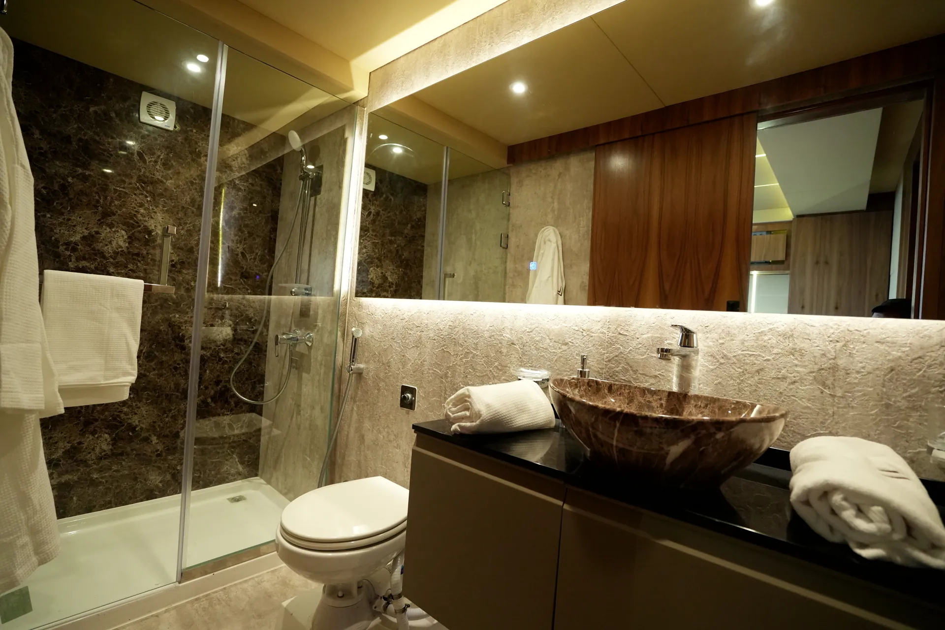 AQUATOR 40+ bathroom with a stone basin and a glass shower