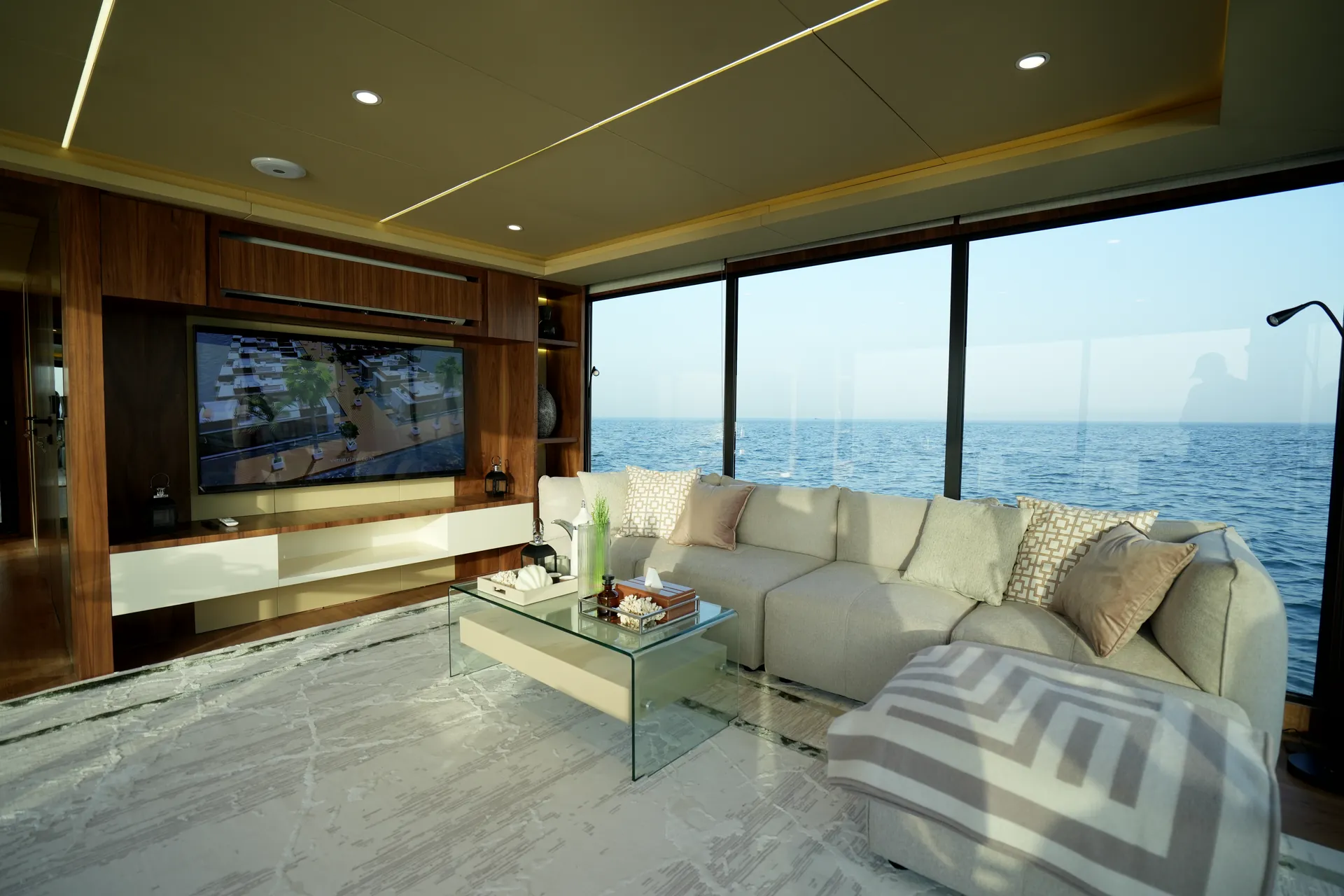 AQUATOR 40+ lounge with a corner sofa facing the sea