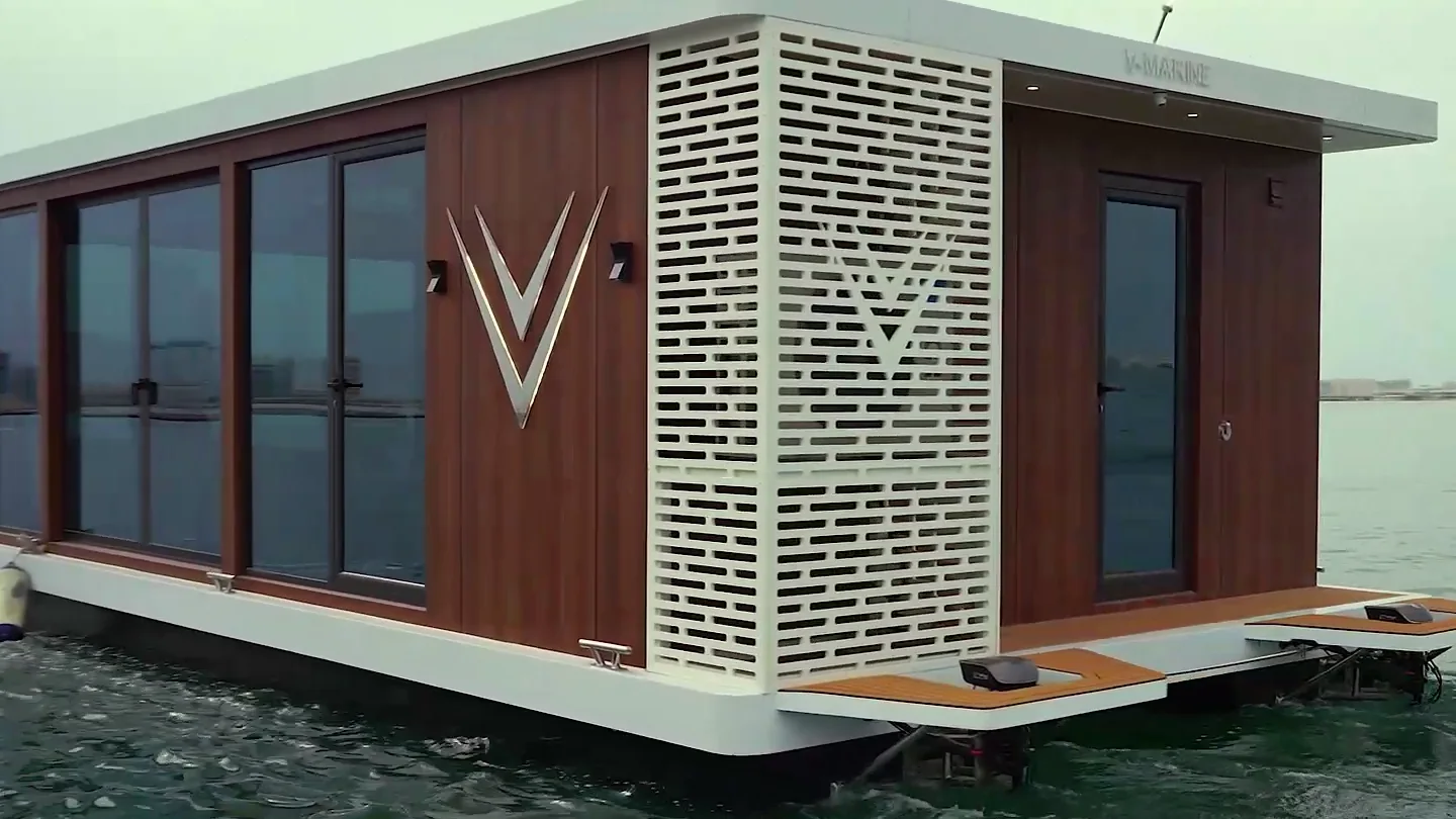 Close view of the timber cladding, V emblem and white lattice screen
