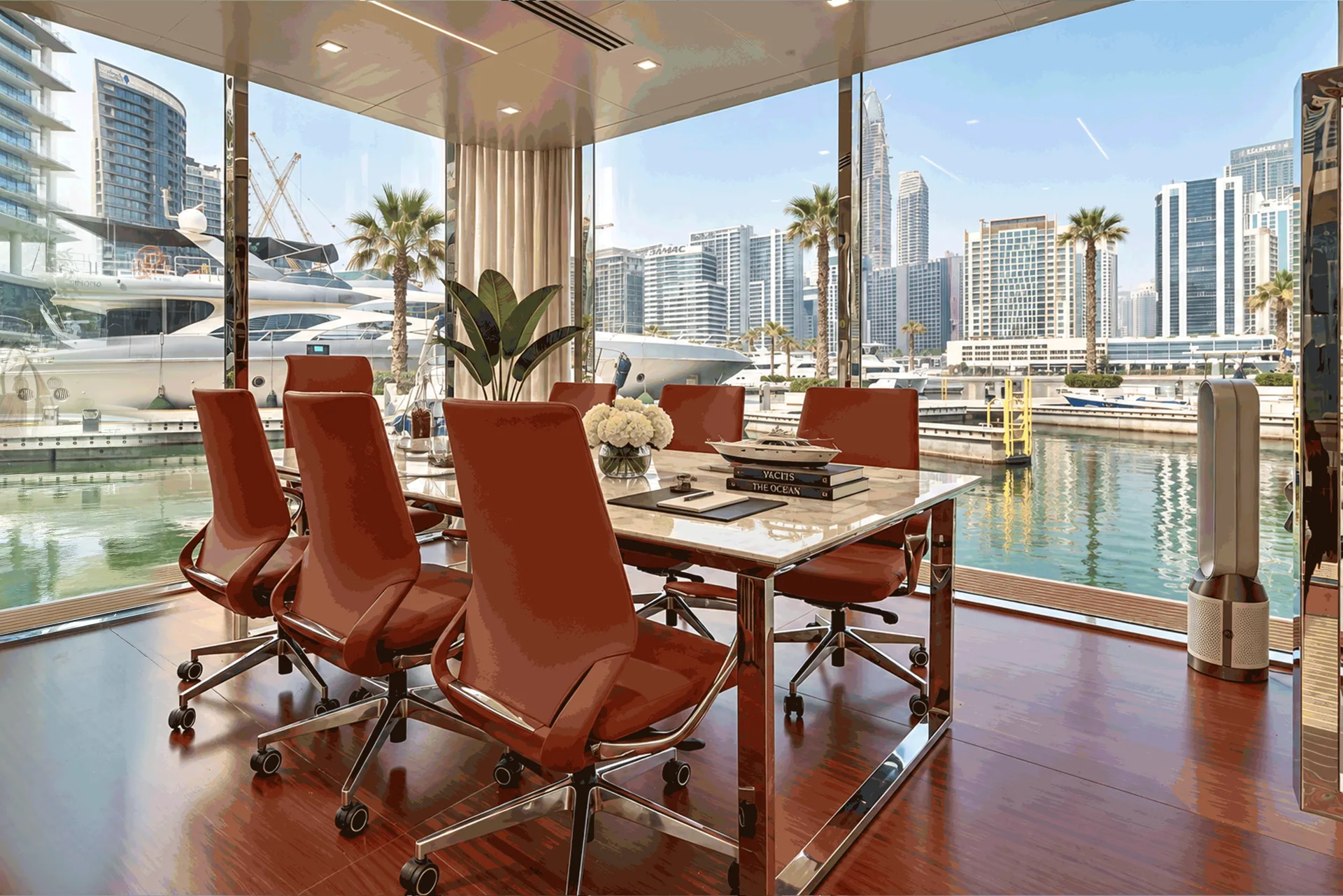 Meeting table with leather chairs and a wide view of the marina