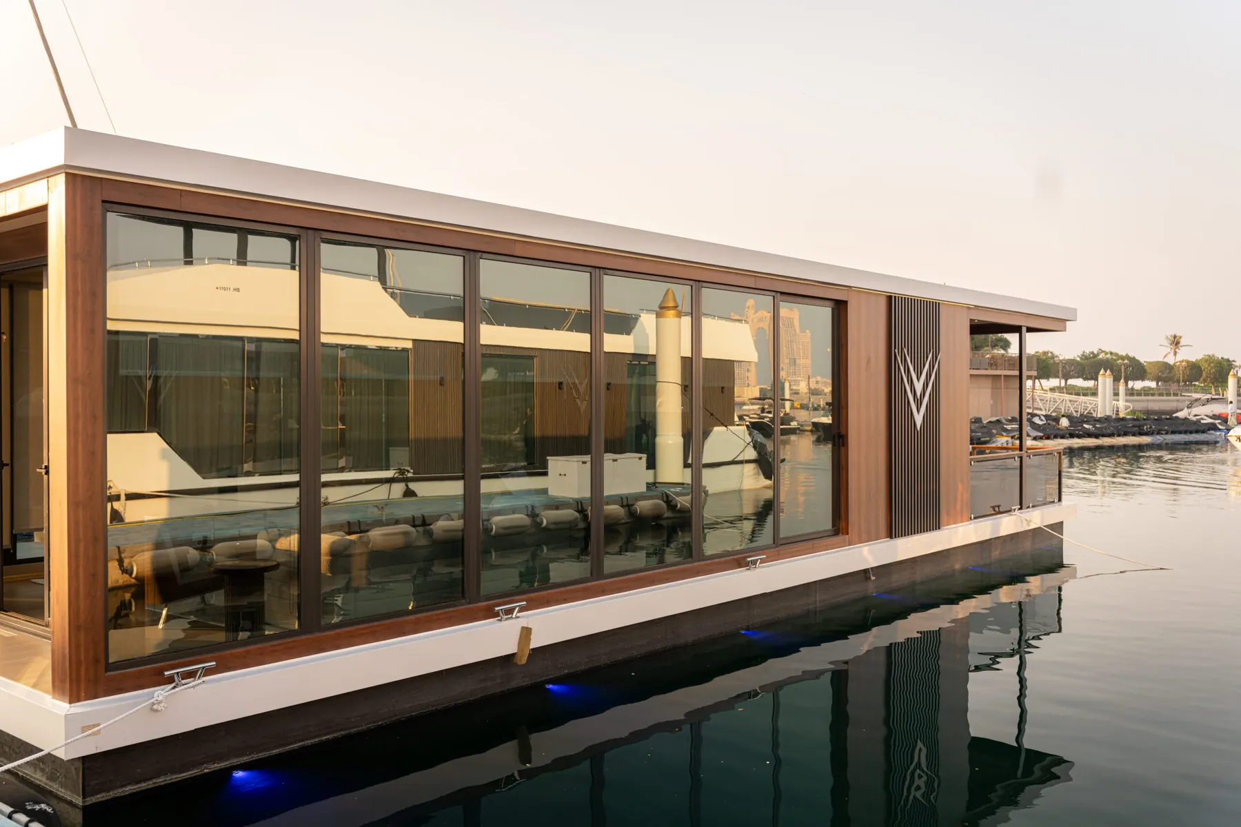 V-Marine Floating Office with full-height glazing and timber cladding, moored in a marina