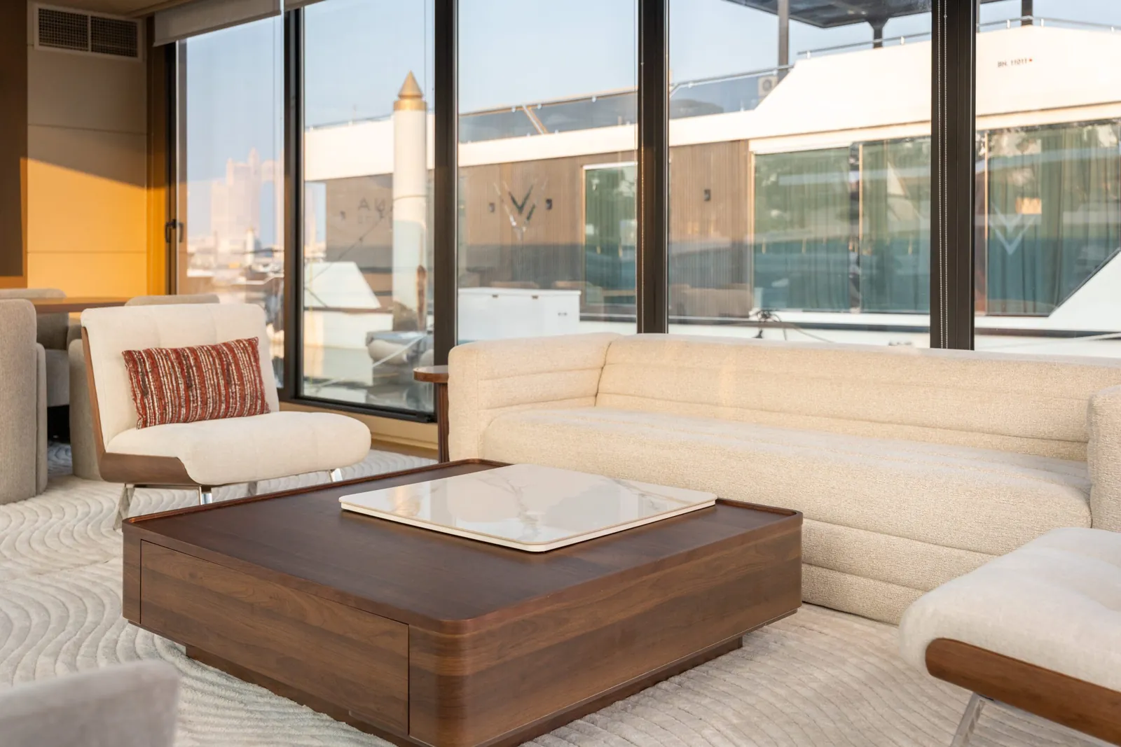 Floating Office interior with lounge seating, a coffee table and marina views